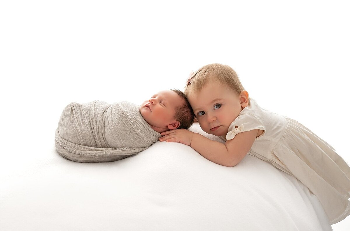 Toddler with newborn