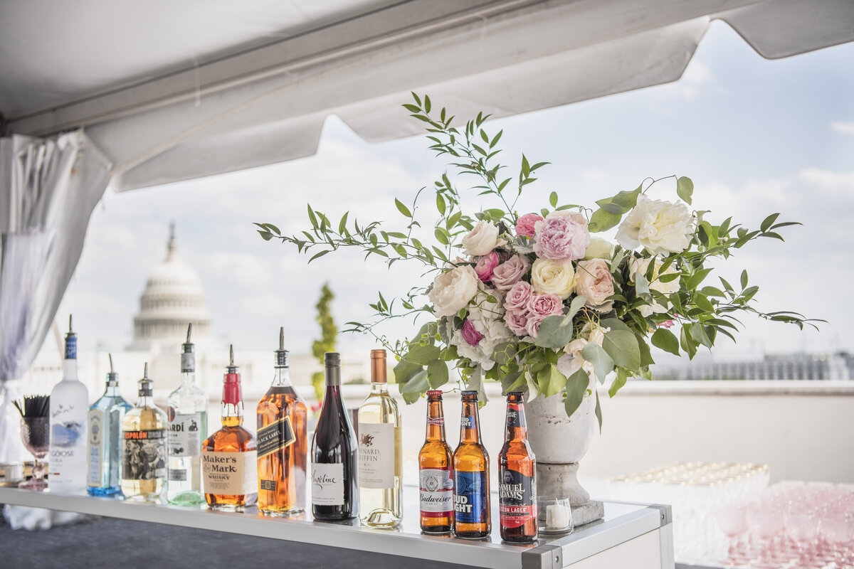 A table is set with florals and drinks.