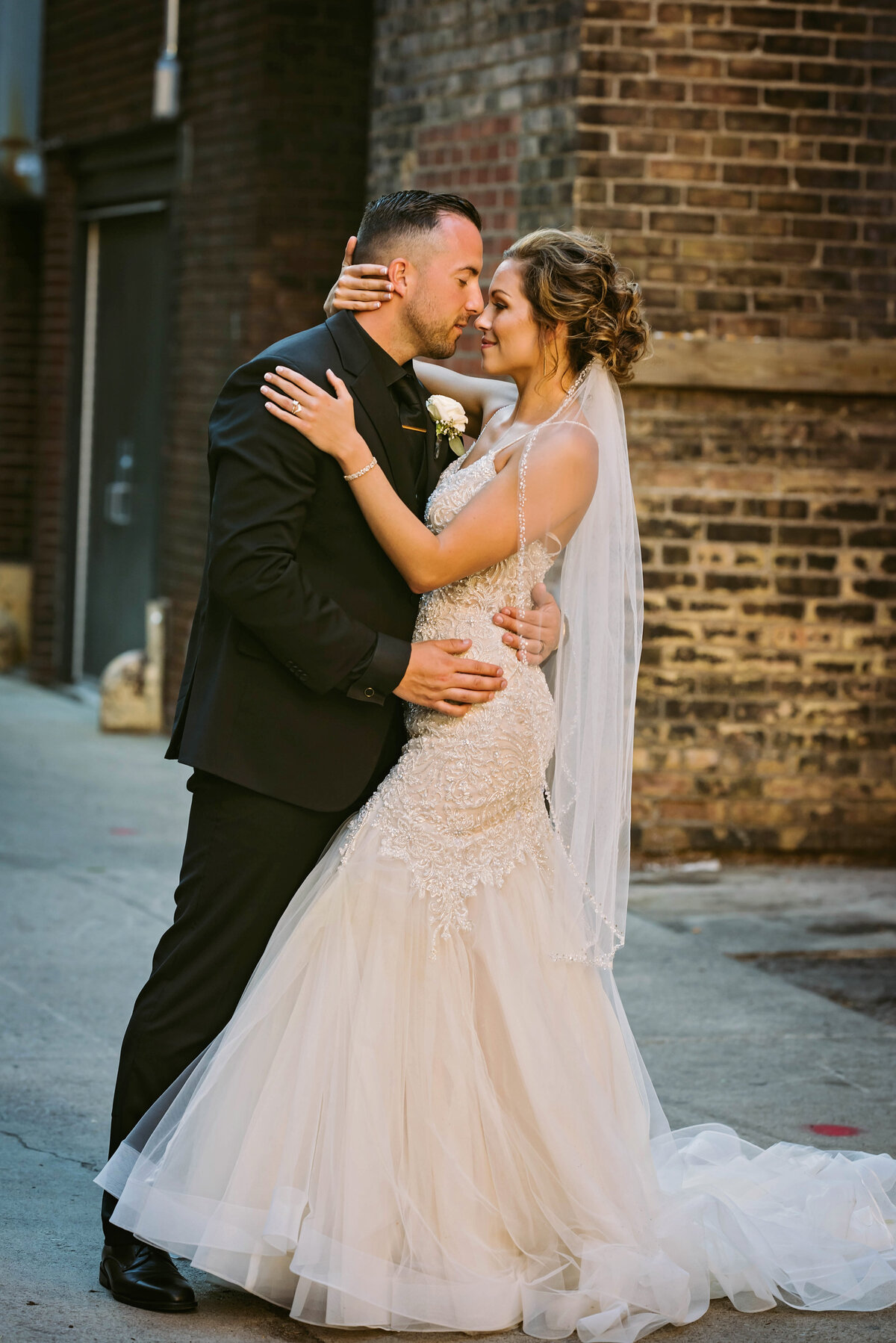downtown bride and groom pose