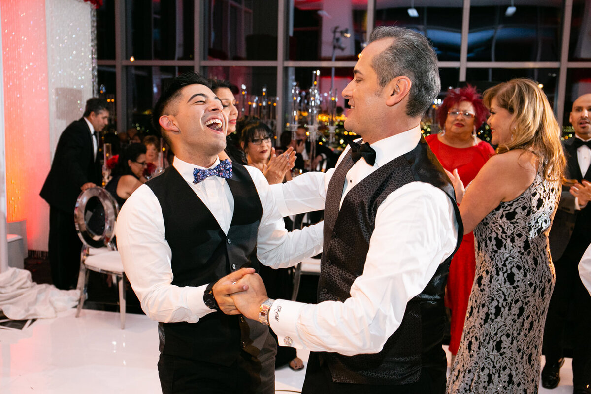 Two grooms dancing at their wedding