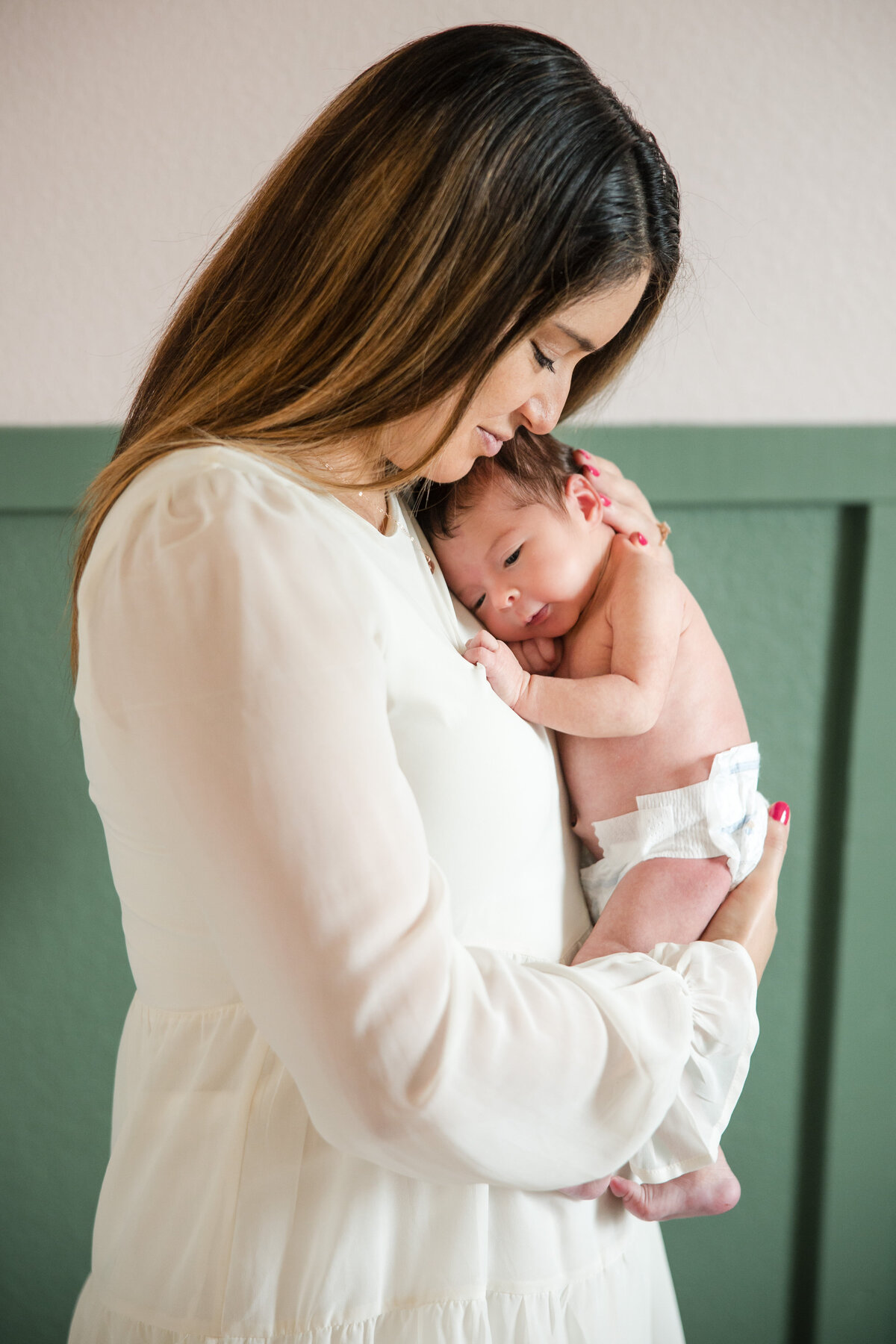 Newborn with mom in white