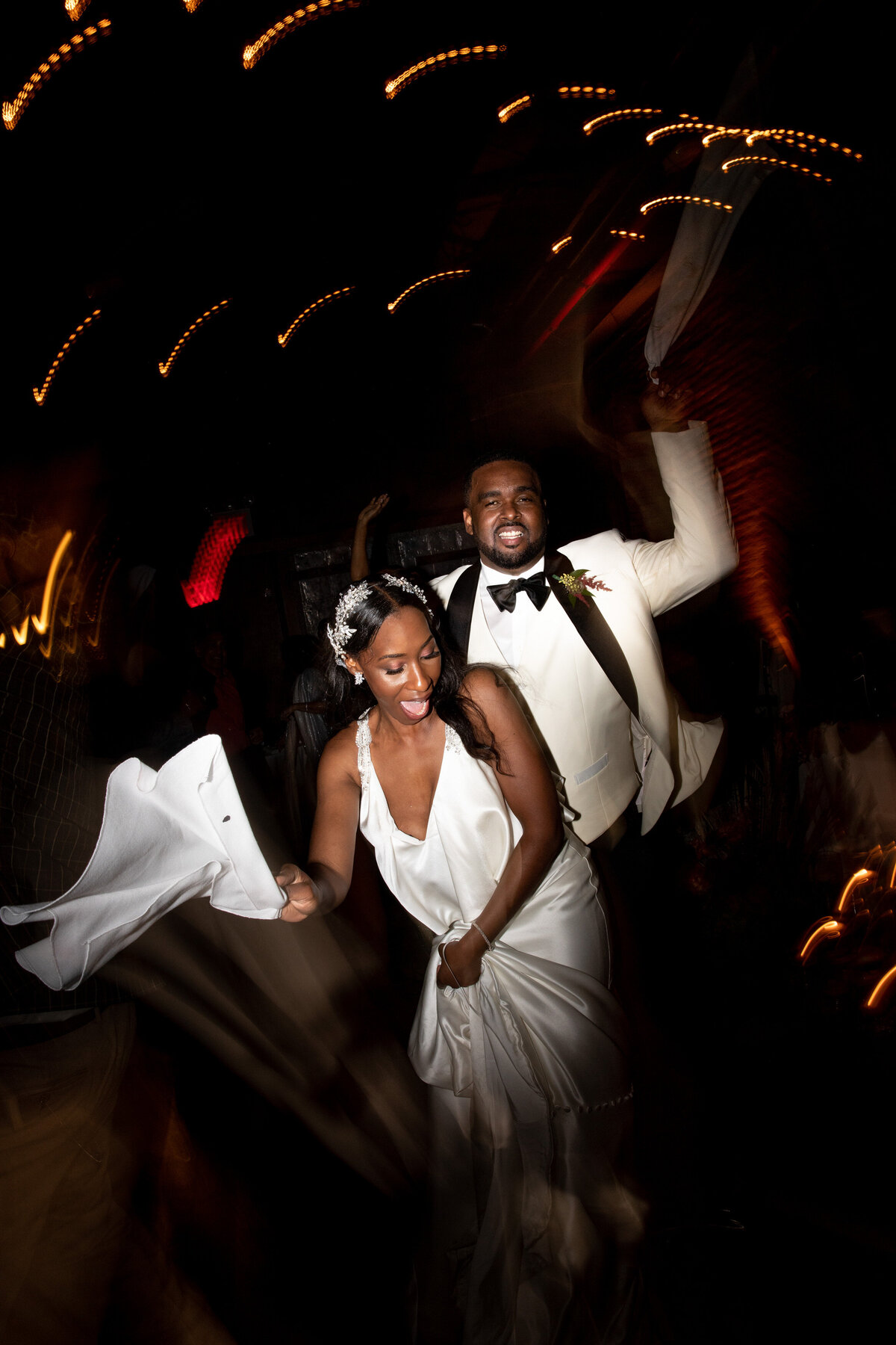 A bride and groom dancing at their reception.