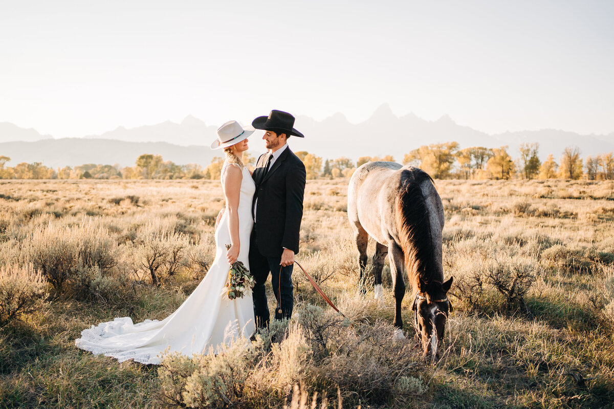 Couple with their horse in front of the Tetons