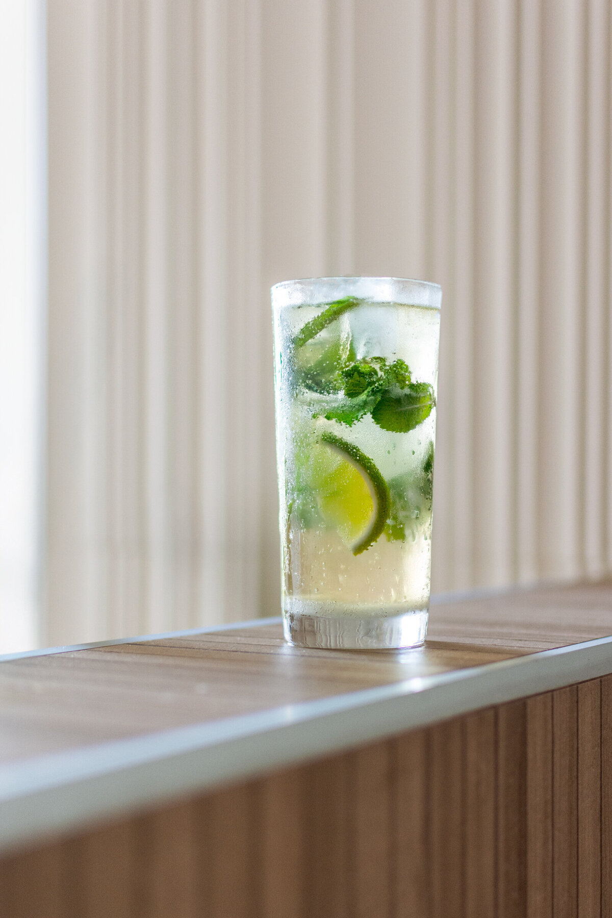 A white rum mojito photographed at a high end bar in Cancun, Mexico.