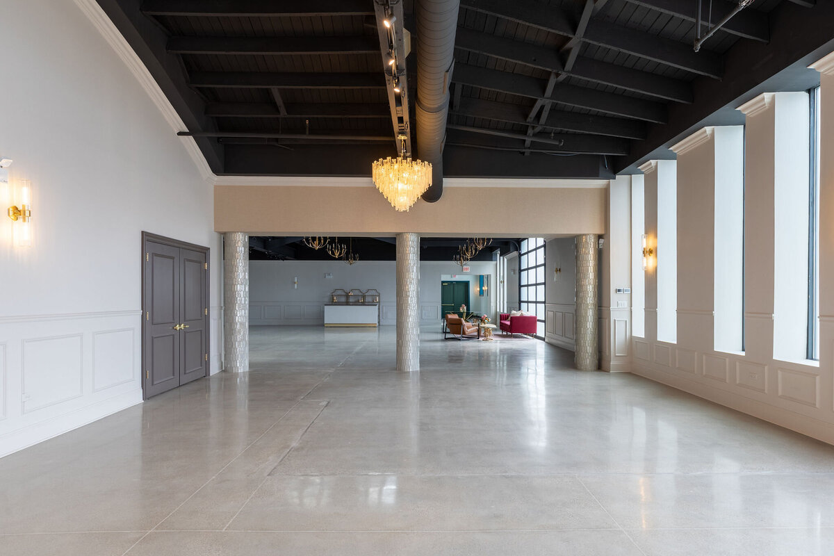 Happy Hour extended space, unique chandelier addition with natural lighting, entrance to Green Room and ceremony aisle