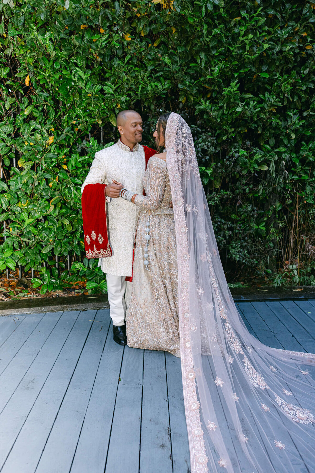A wedding photo of the bride and groom embrassing each other after their ceremony in Dublin Ireland