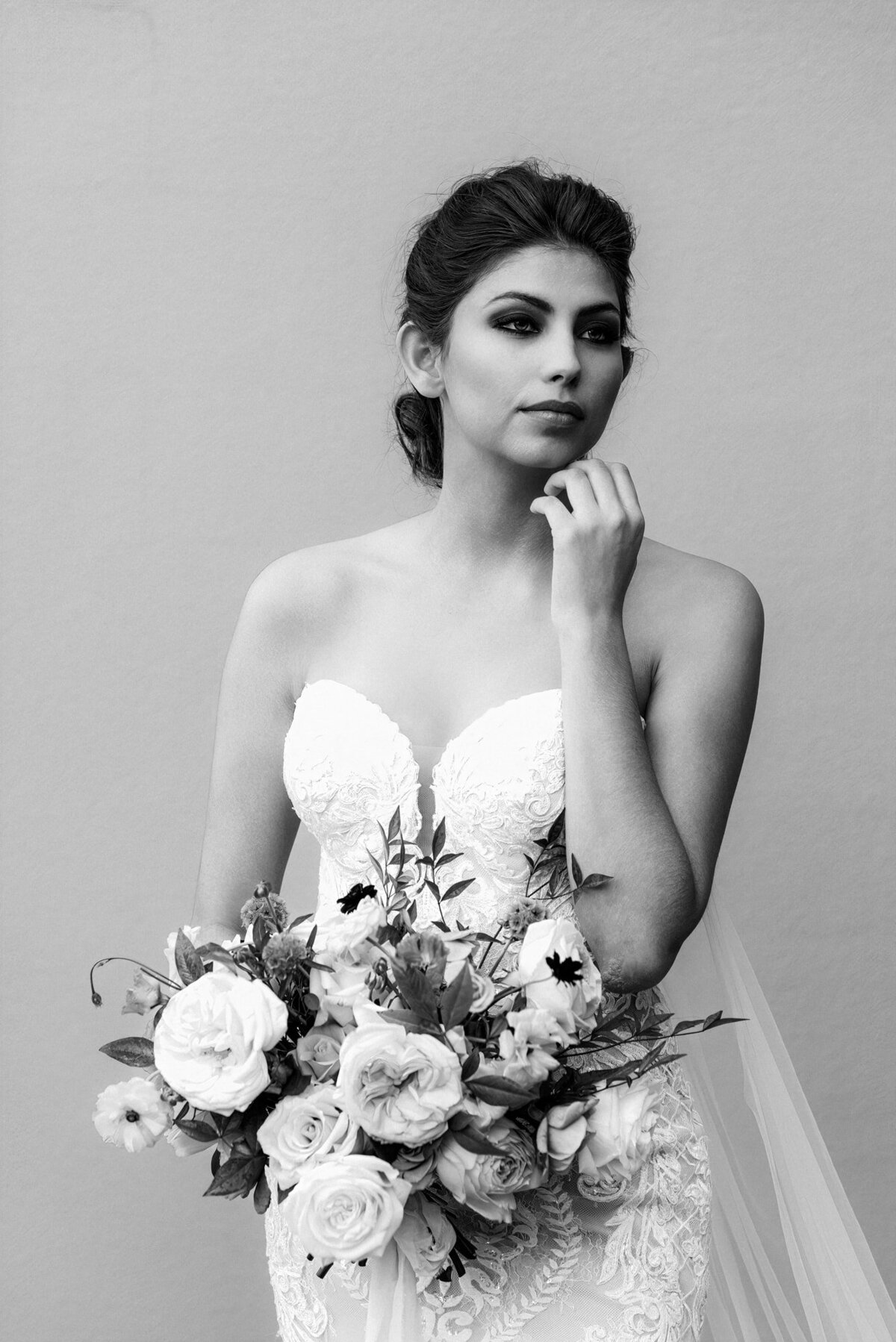 Luxury portrait of bride holding bouquet