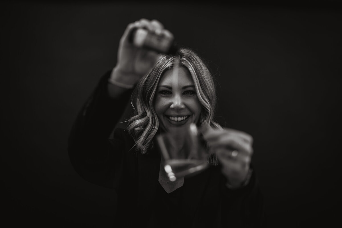 A styled brand shot of Emily applying color with care and precision, focused on healthy, lasting results.