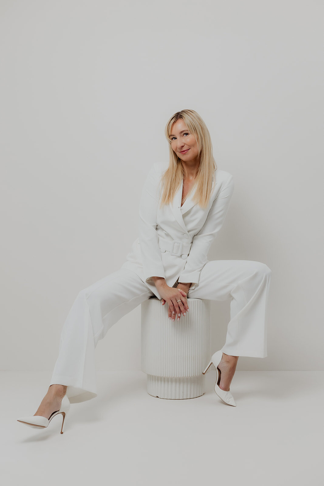 luxury portrait of woman in all white