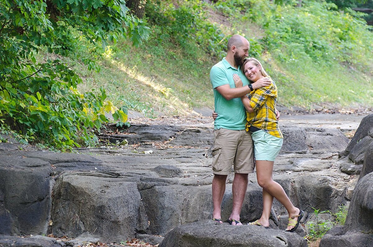 Engagement session image  photographed on a dry waterfall at Twin Lakes Park in Greensburg, PA