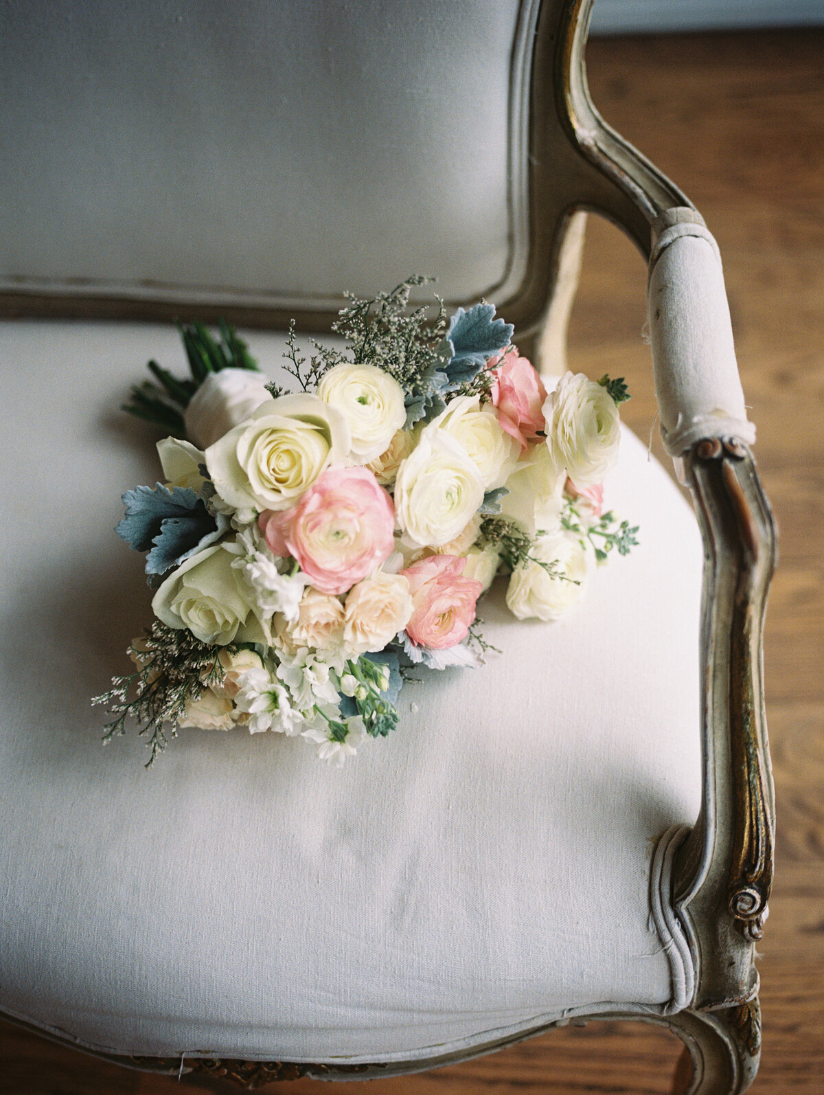 Bridal bouquet with white and pink flowers on film in chateau