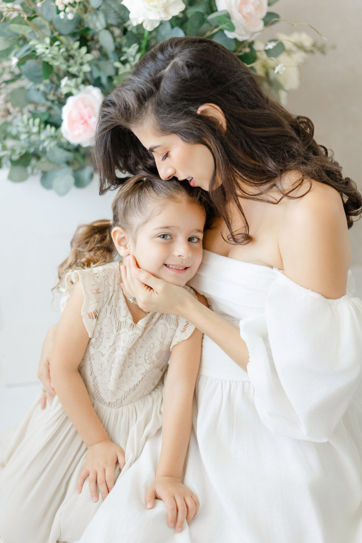 Joyful Tampa motherhood portrait of mom holding her daughter with love