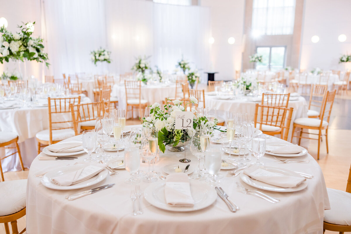 White wedding flowers for a timeless reception. Custom centerpieces and wedding floral arrangements for waterfront wedding venues in Maryland.