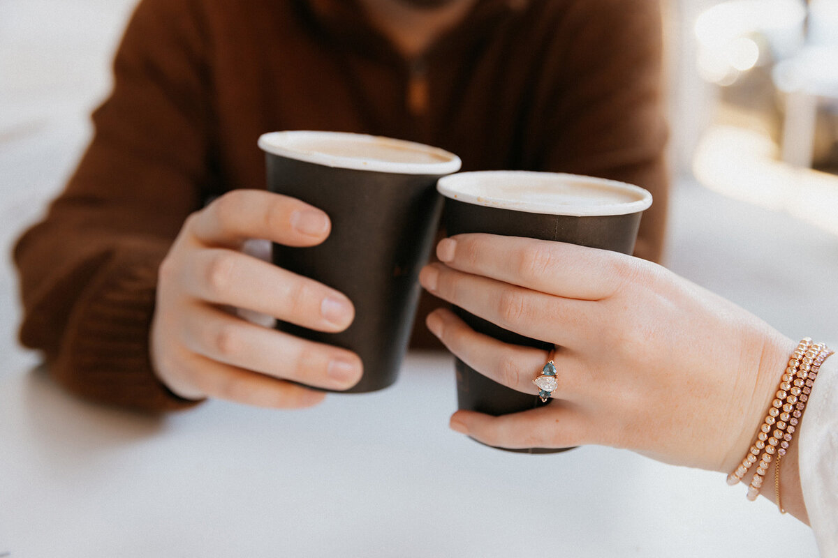 couple holding coffee