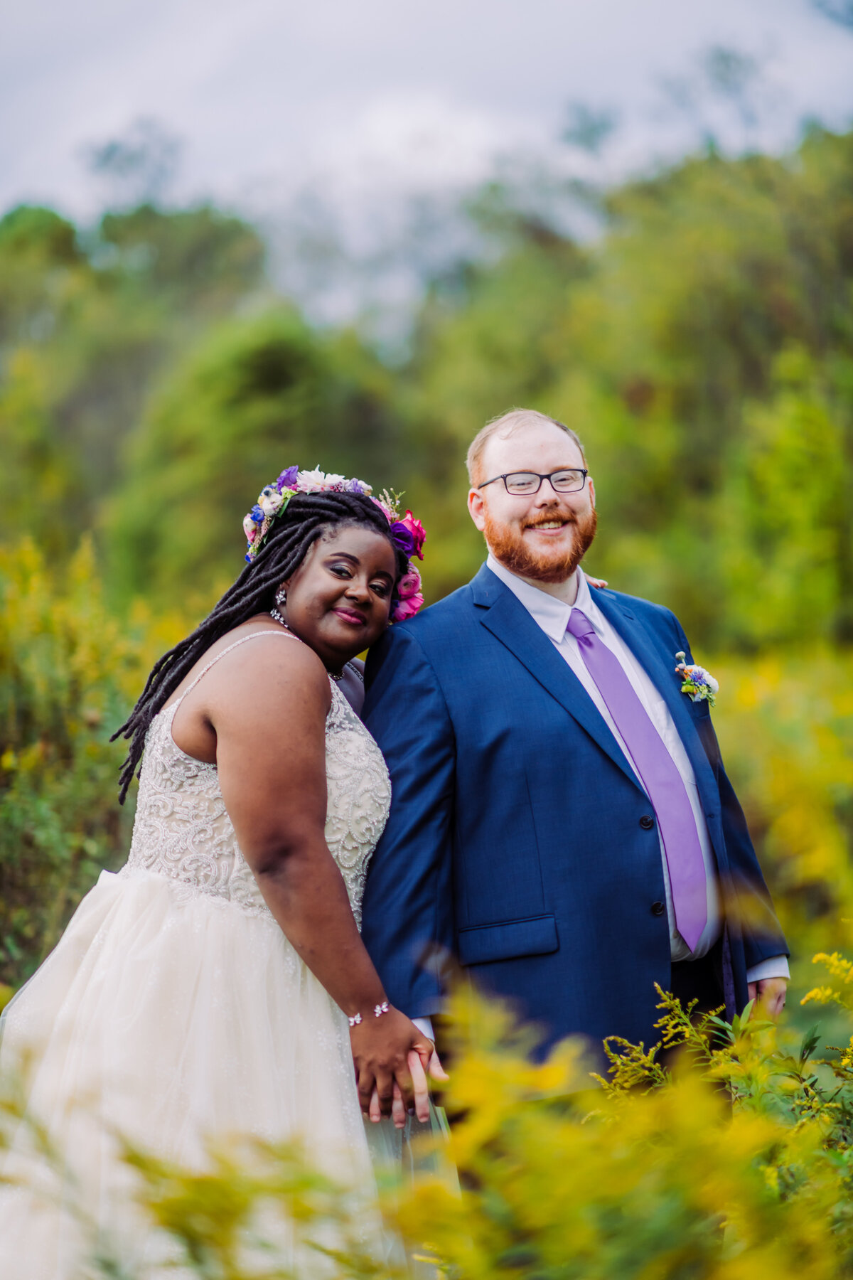 wedding couple in the field at the pittsburgh botanic gardens