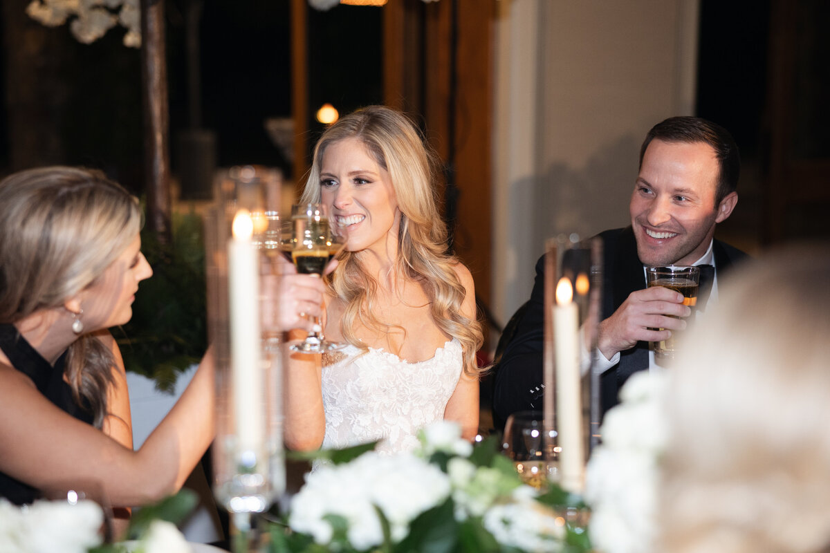 Candid moment of bride and groom at wedding reception taken by Arizona Wedding Photo and Video team