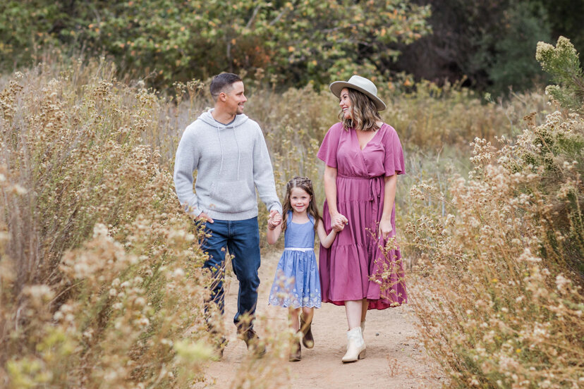 family-of-three-walking-on-path--sweetwater-river-bridge-san-diego