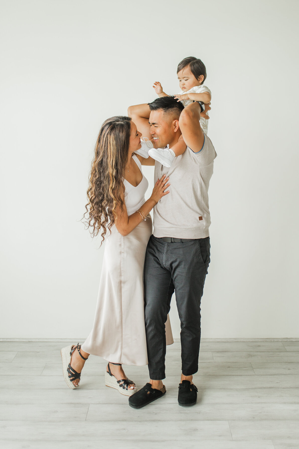 family of three having fun indoors