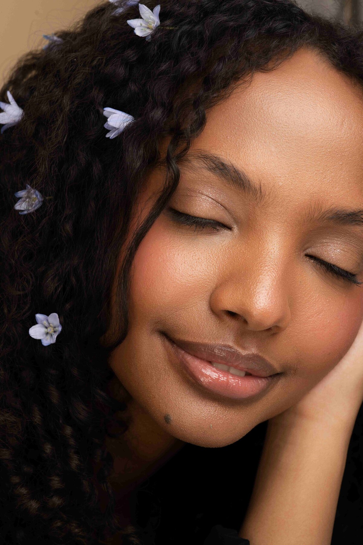 model posing with flowers in her hair