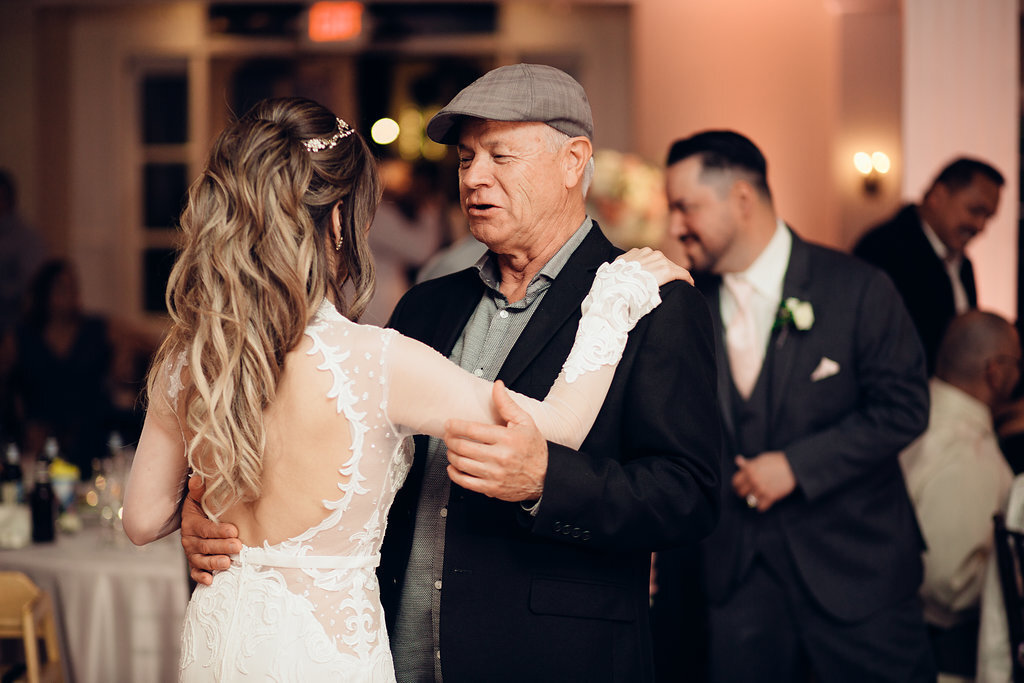 Wedding Photograph Of Man In Black And Gray Suit Dancing With The Bride Los Angeles
