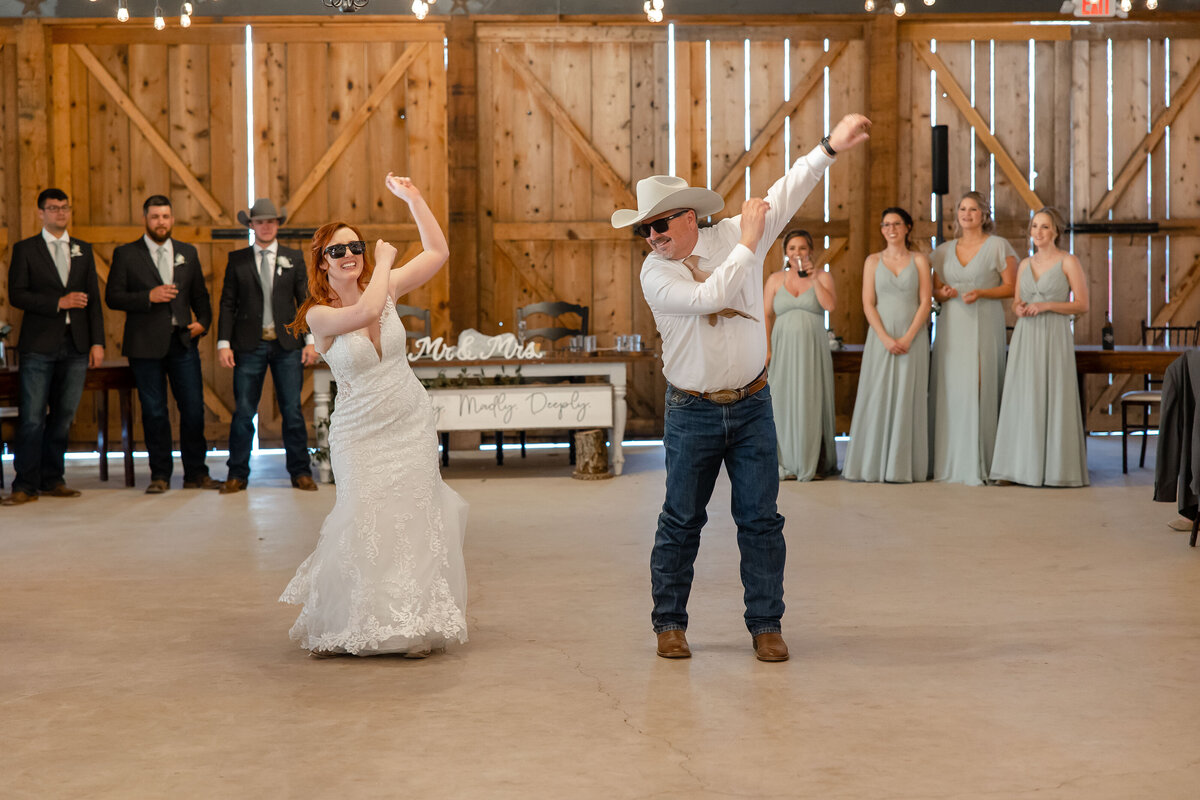 bride and father wear sunglasses and dance choreographed performance