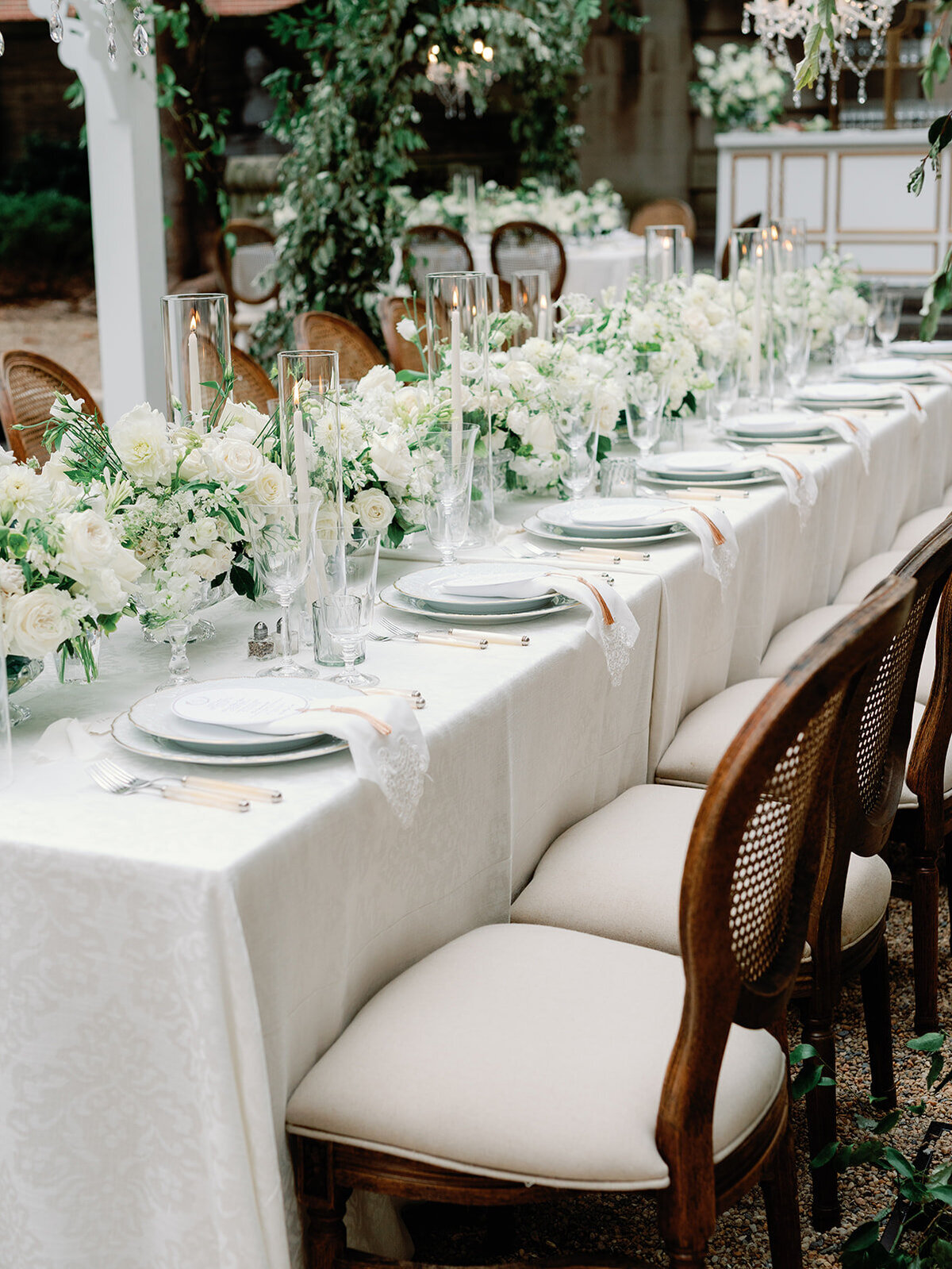 Classic wedding decor with creams and greenery