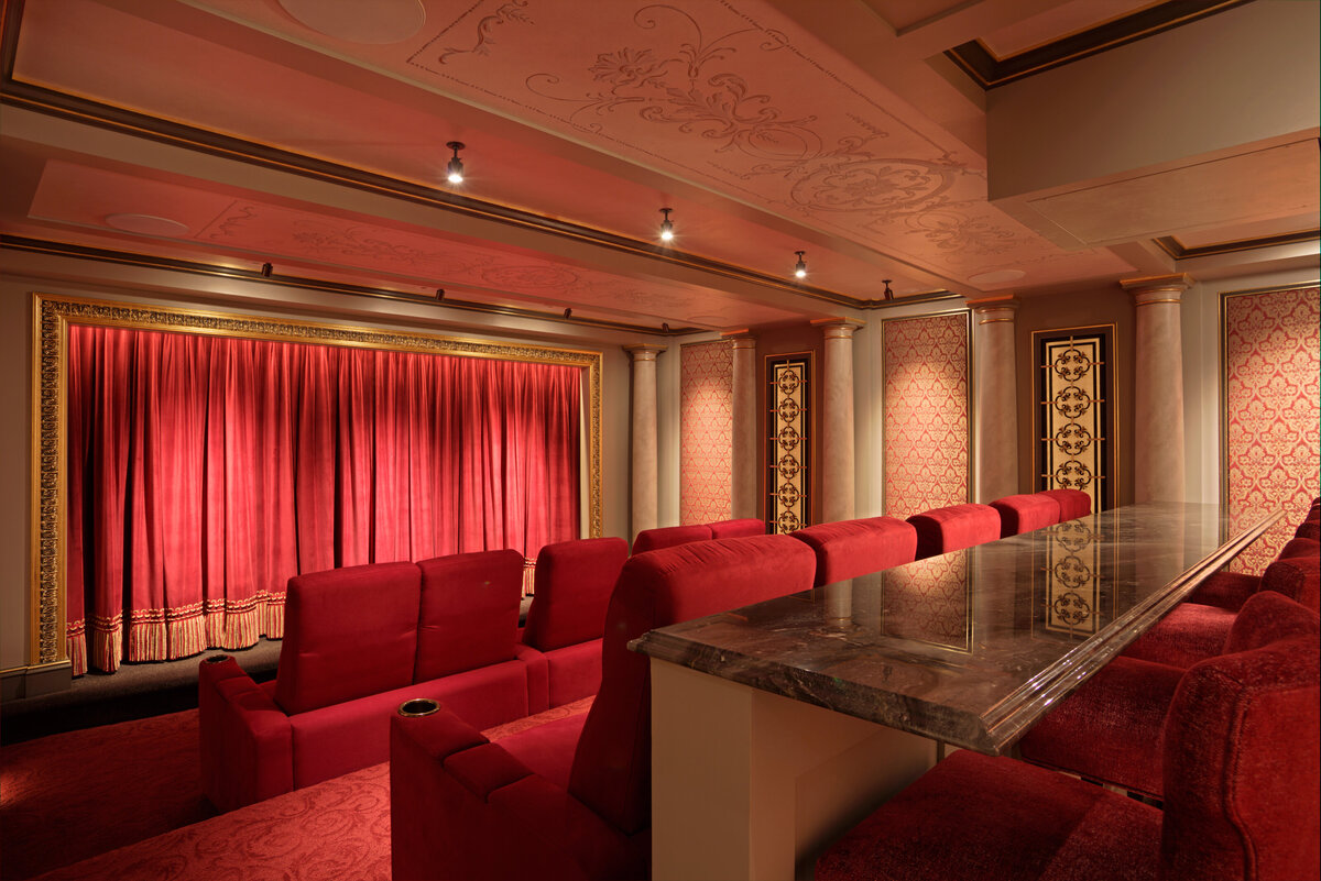 theatre room with bright red floor and chairs