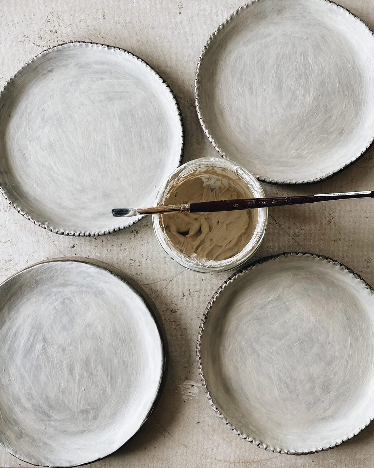 brushing_on_slip_on_plates_mobile