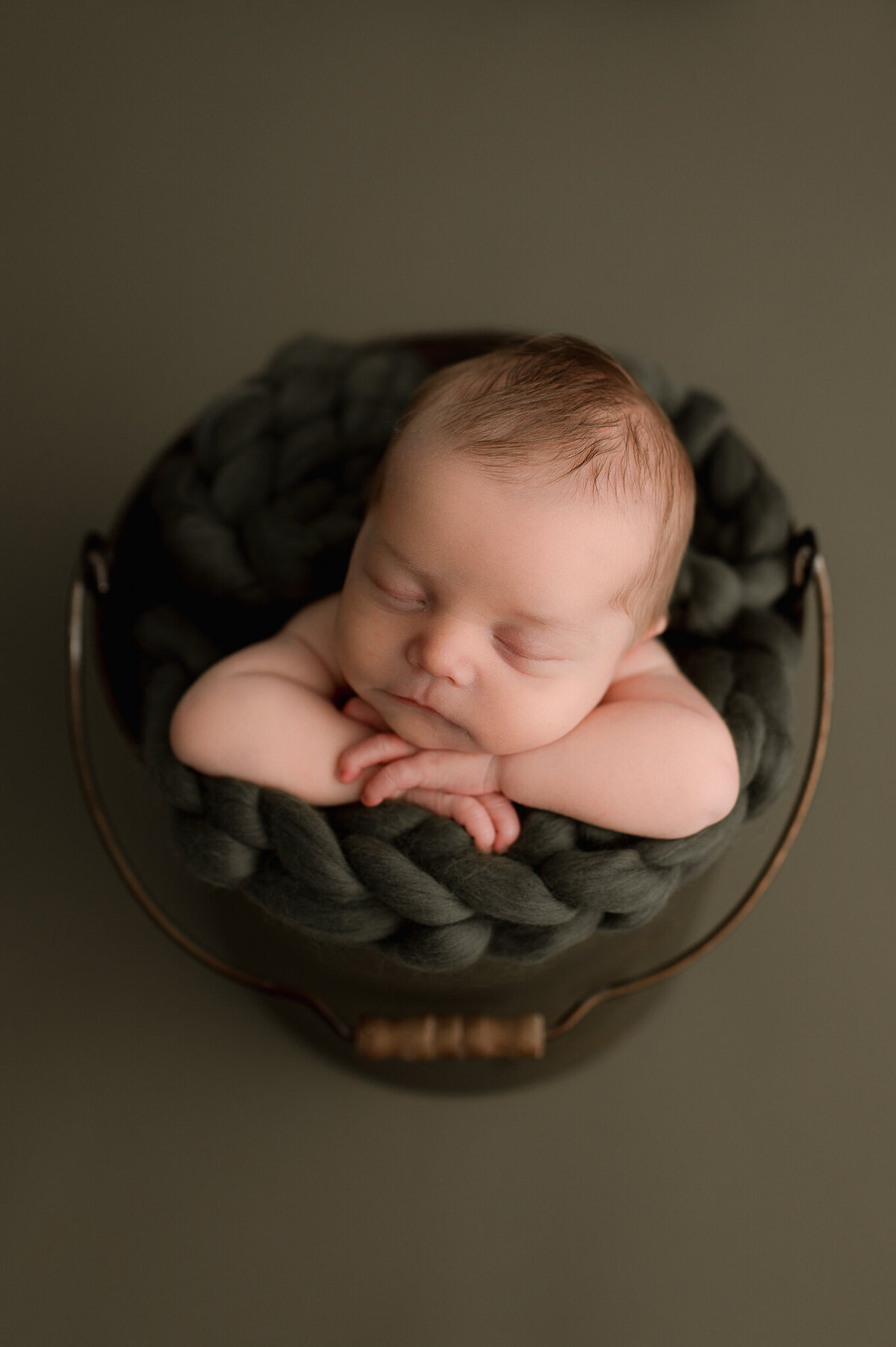 Infant posed safely in Swanton Ohio photography studio