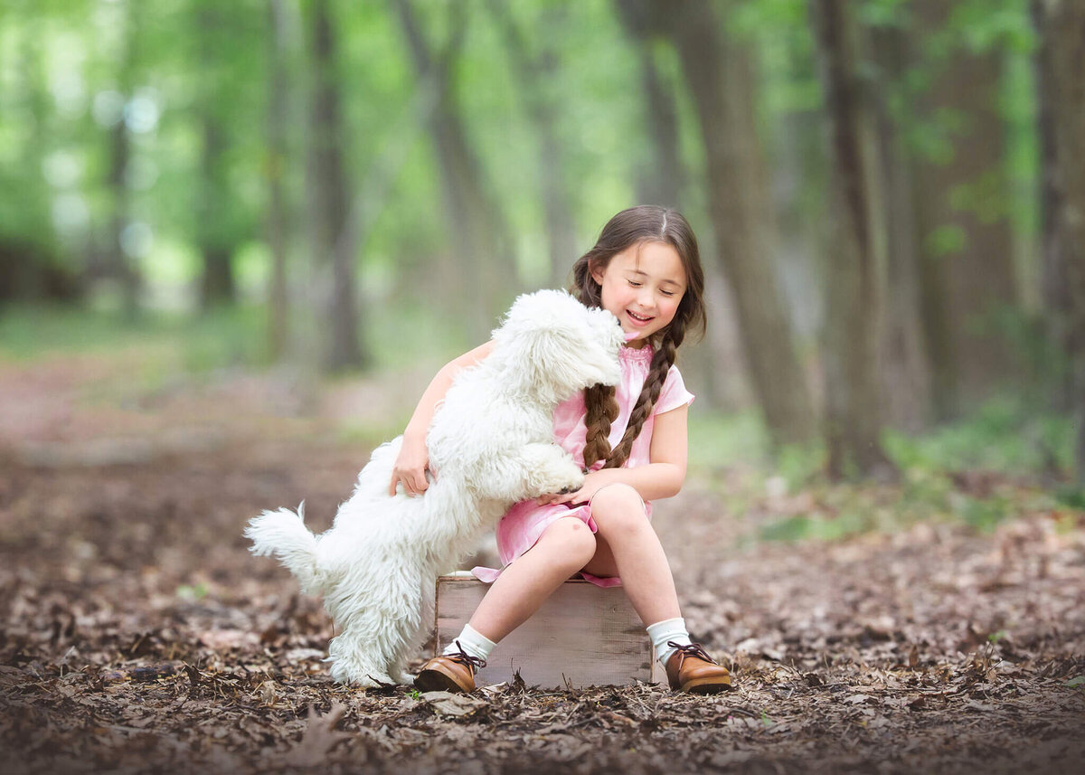 Girl and her dog at the park laughing - Los Angeles Children’s Photographer
