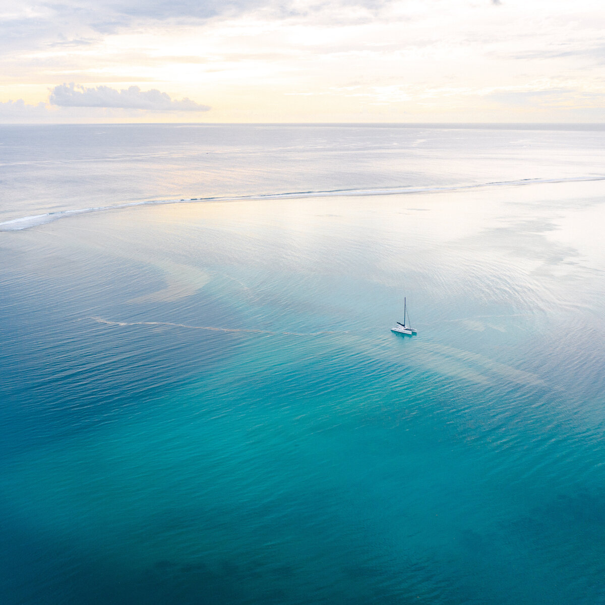 Moorea-Drone-Aerial-Boat-Blue-lagoon-sunset-1