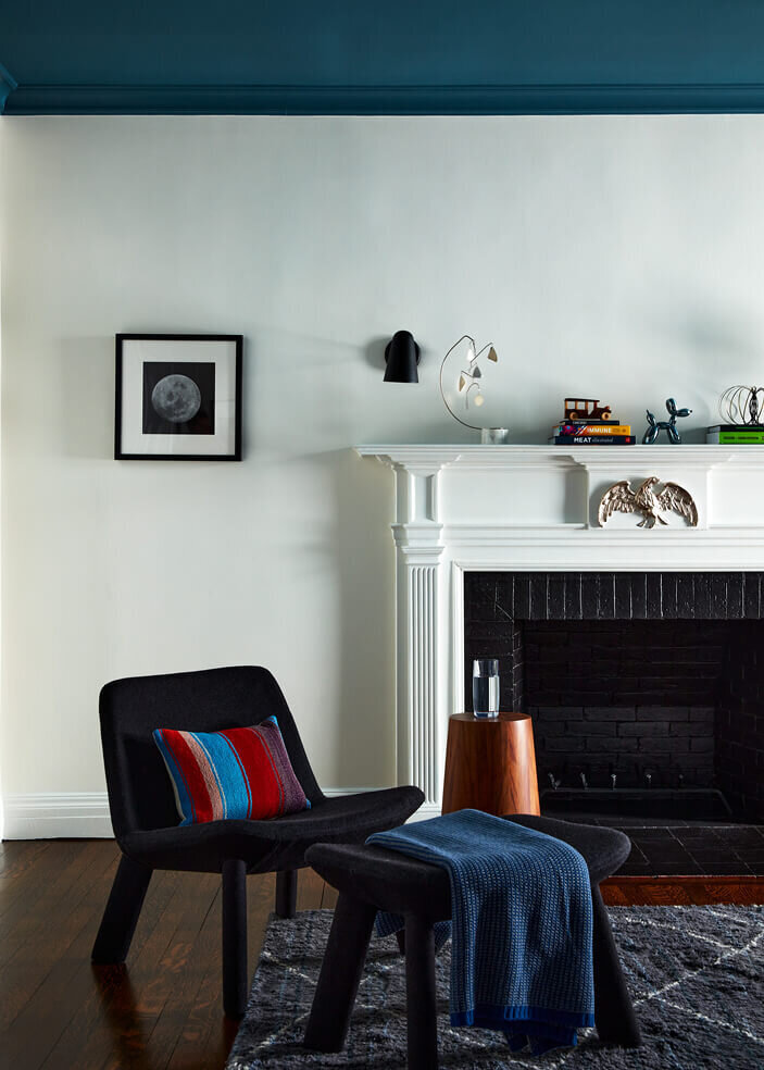 Interior decorator in Boston MA designs a kid bedroom with a historic fireplace, blending style and functionality in a unique space.