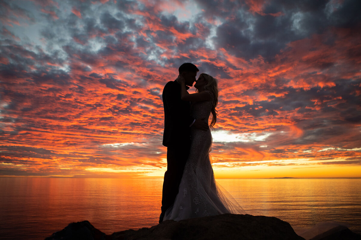 bride and groom with sunset