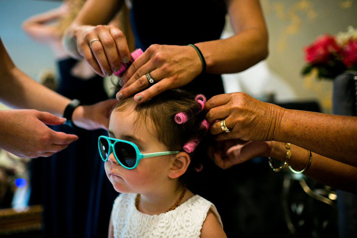 Idaho Springs Colorado wedding getting ready flower girl with sunglasses