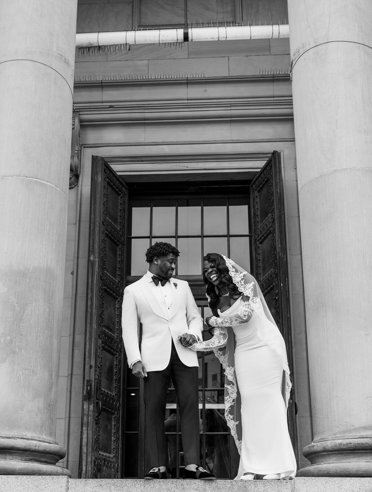 couple laughing on steps