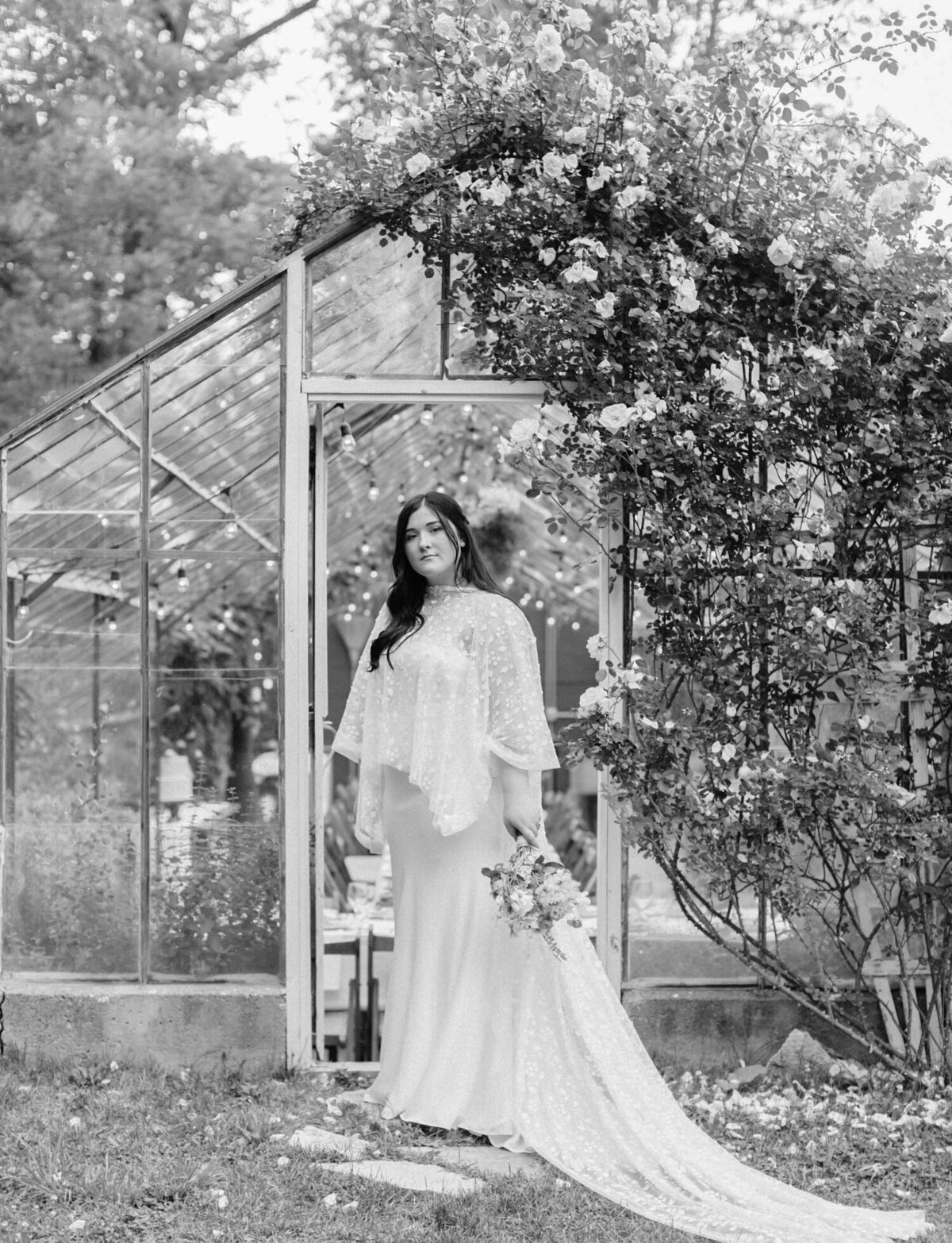 bride with bridal cape, glass greenhouse wedding venue, Michigan