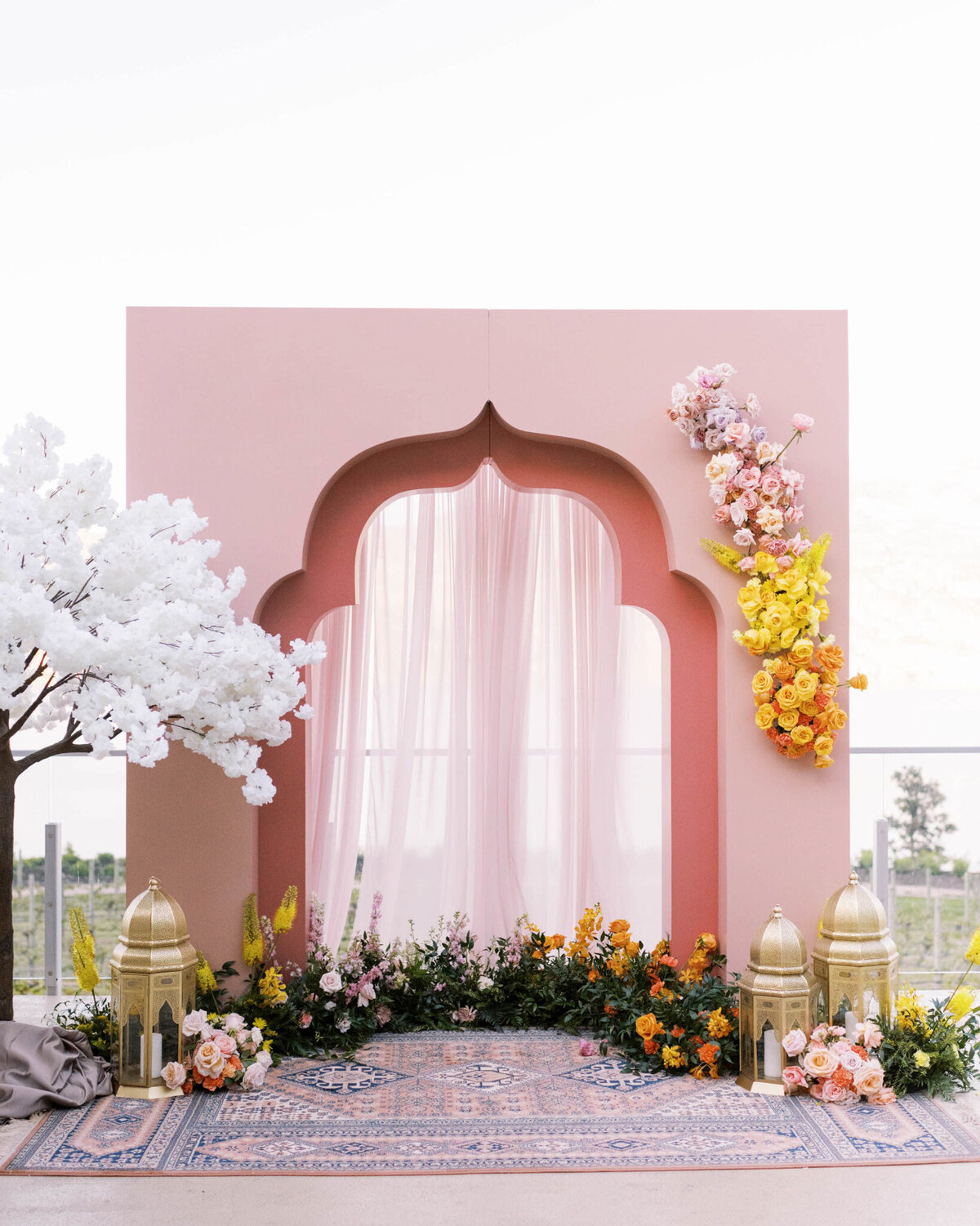 Pink moroccan themed ceremony decor, florals by Valley Bloom Co, bright and airy wedding florals based in Kelowna, BC. Featured on the Brontë Bride Vendor Guide.
