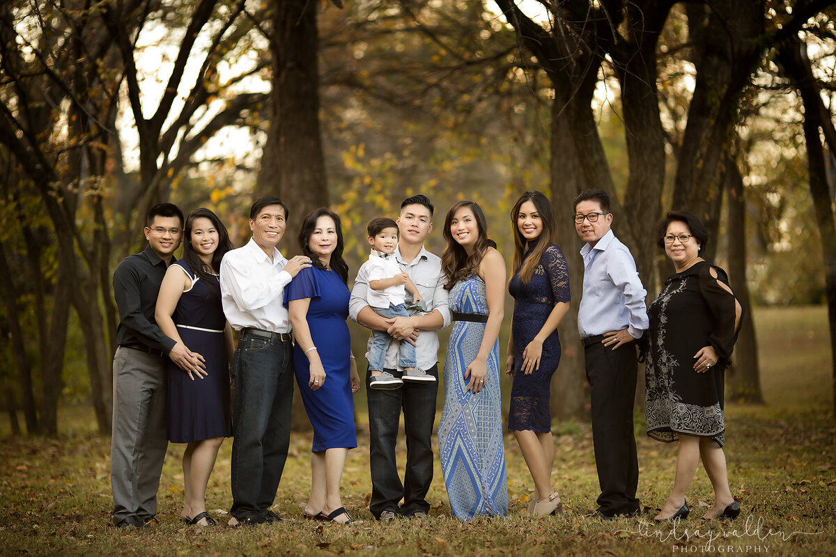 A family of all generations gathers together for a beautiful autumn family portrait captured by a Dallas family photographer.