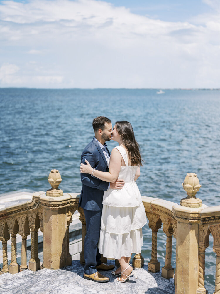 bride and groom hugging near the ocean