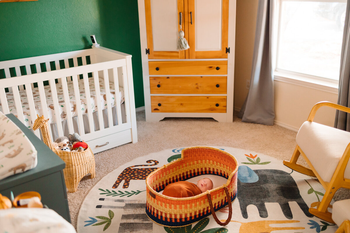 The best maternity photography services in Albuquerque with this serene image of a newborn’s bedroom. The room is thoughtfully arranged with a white cradle and essential baby care tools, creating a peaceful and welcoming environment for the new arrival.