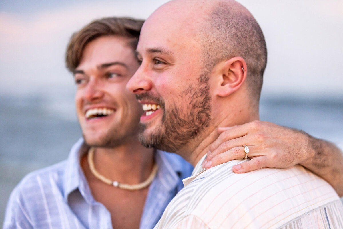 newly engaged couple on deer lake state park beach.