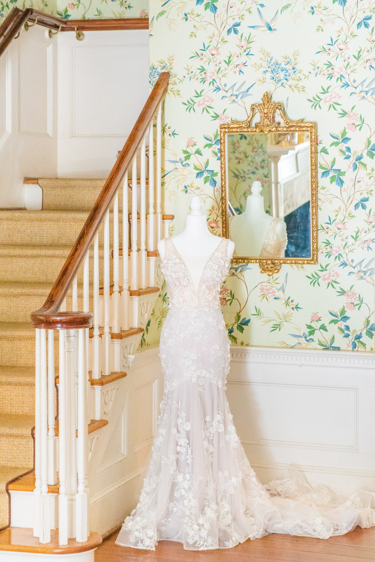 modern floral wedding dress on dress form at legare waring house charleston sc
