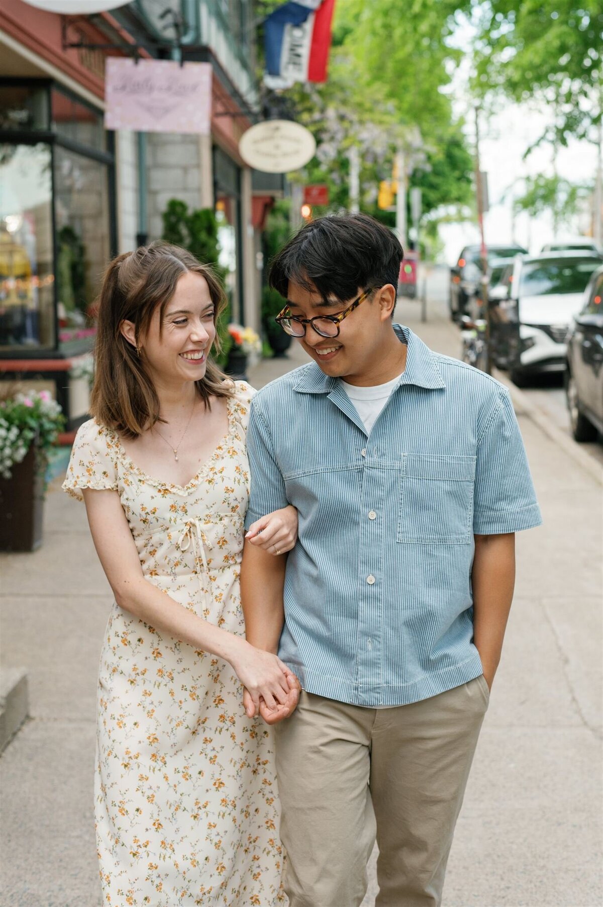 Couple walking arm in arm during Halifax engagement portraits