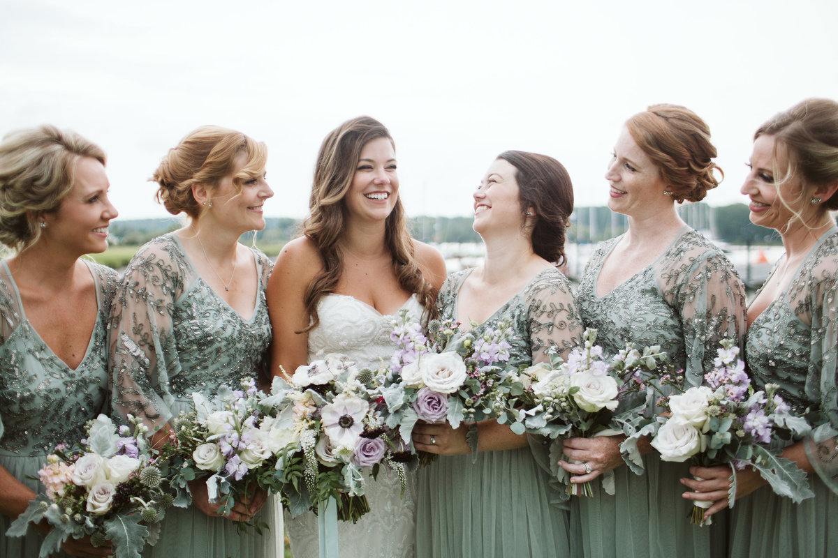 Bridesmaids  with bride and  bouquets at The Oyster Farm