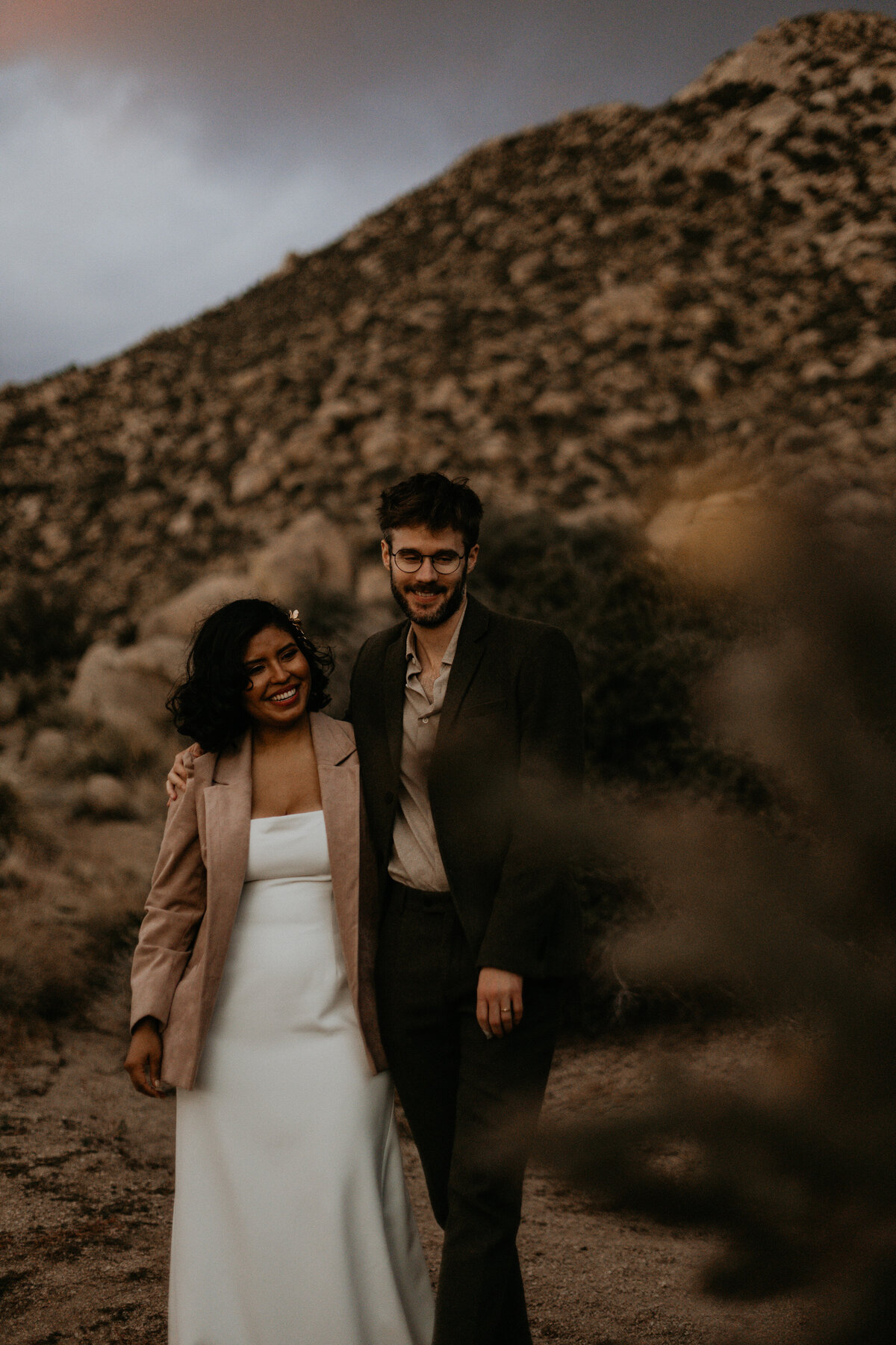 newlyweds holding each other on the Sandia foothills in Albuquerque