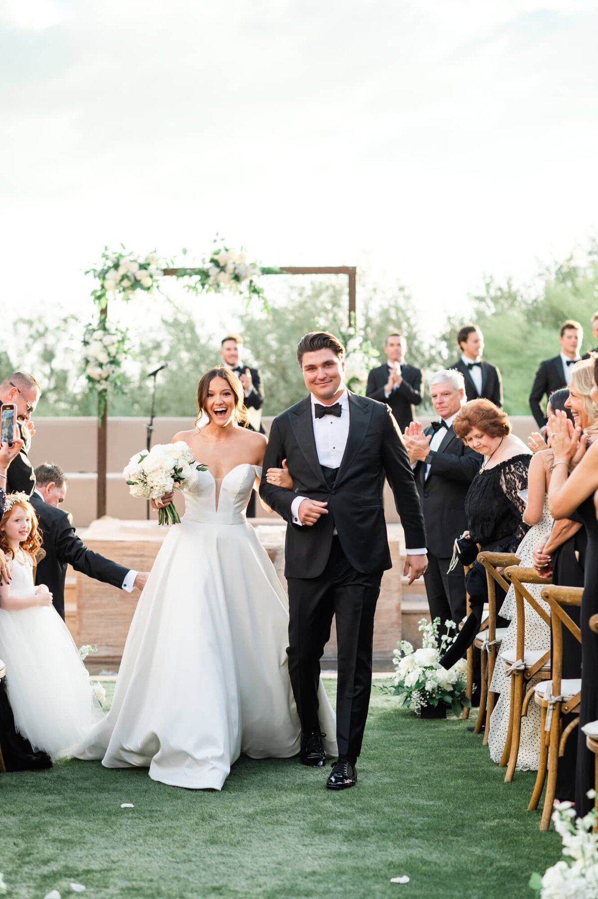Bride and Groom recessional smiling and laughing