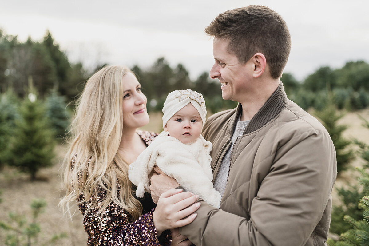 Family Pictures at a Christmas Tree Farm in Leonard Michigan provided by Kari Dawson top rated Michigan family photographer45