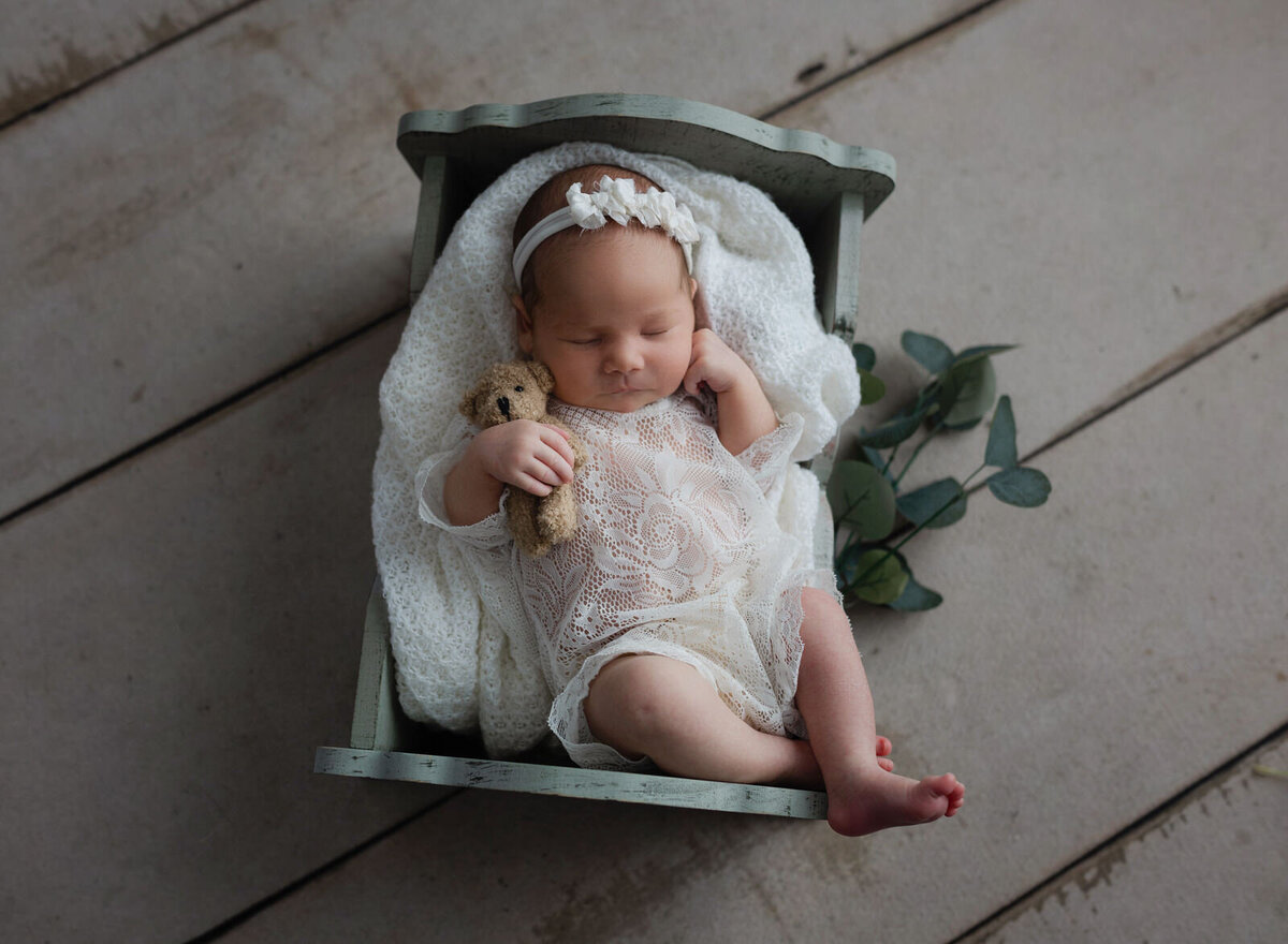 newborn-girl-in-cradle