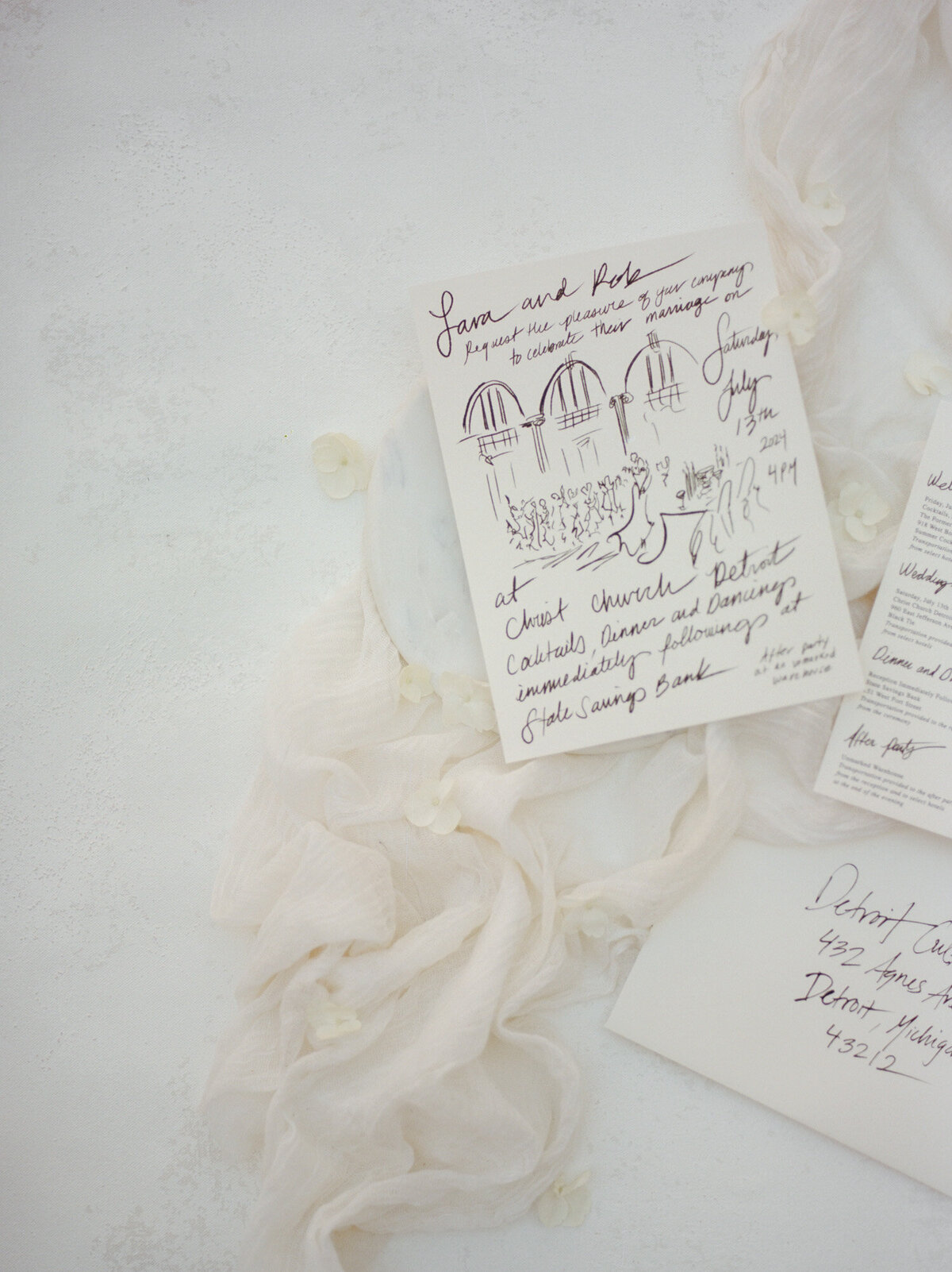 a soft flat lay photo of gestural, timeless wedding stationery handwritten in Detroit, Michigan