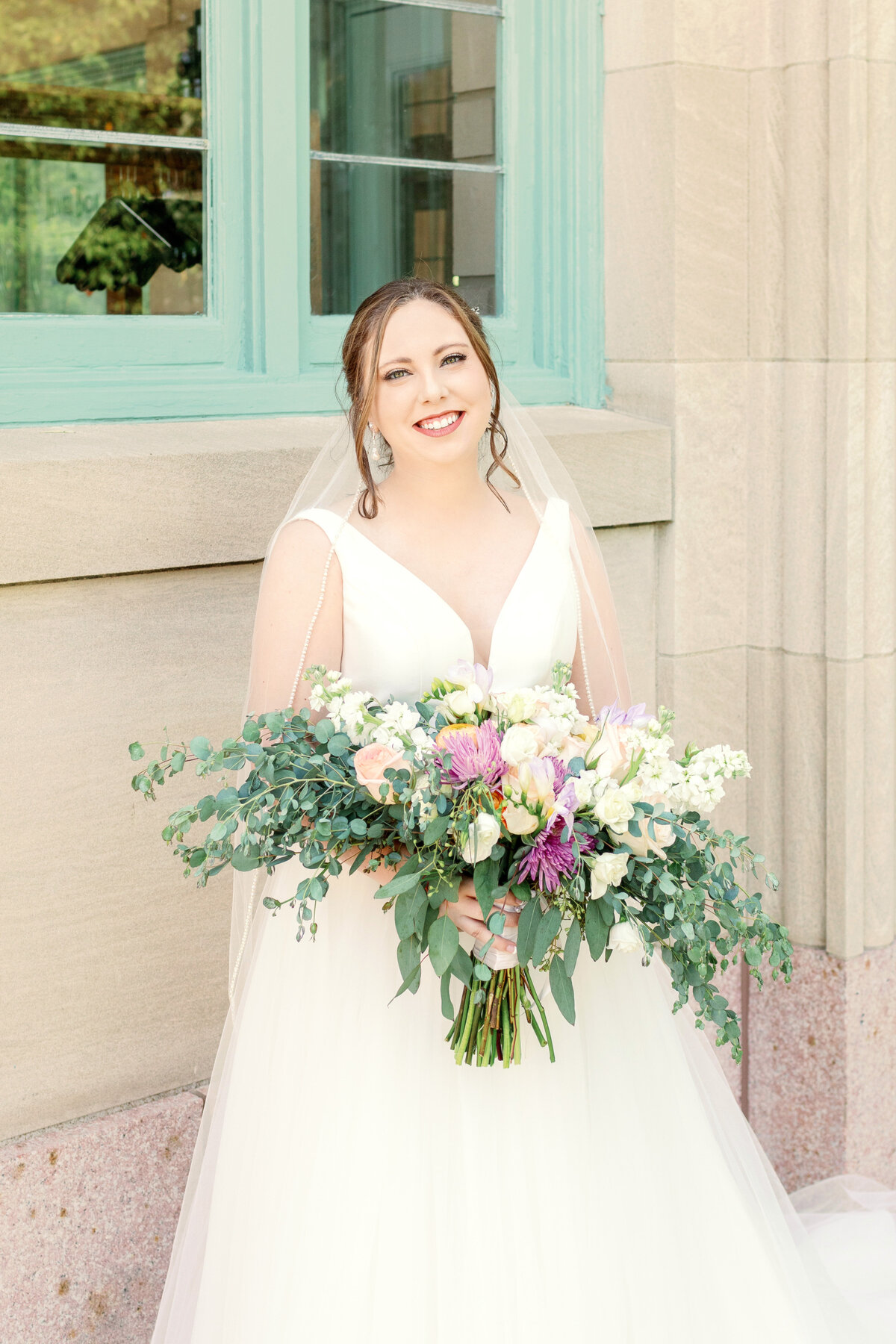 Bride-holding-a-bouquet